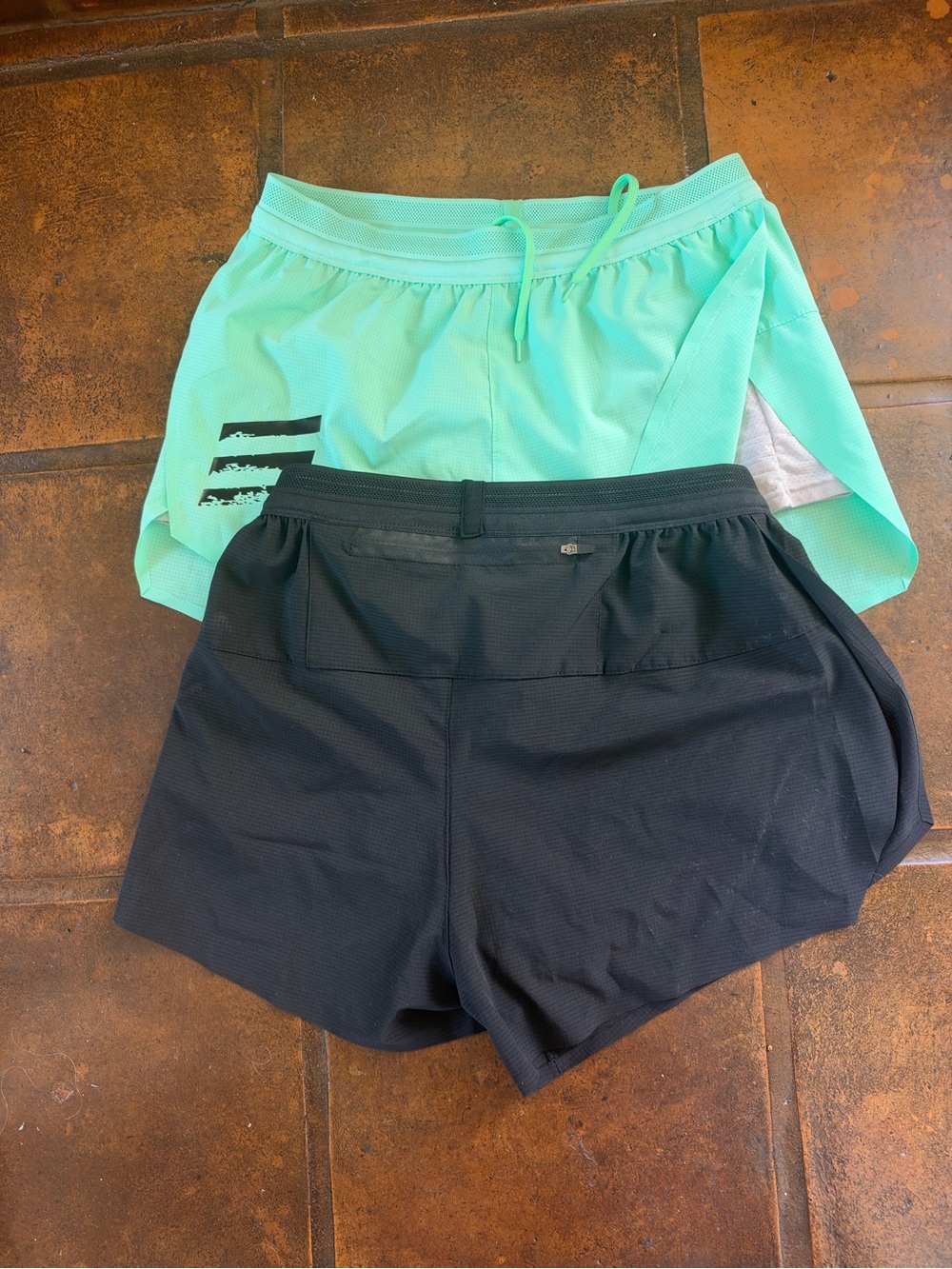 Men’s  Black and Mint run shorts w/ rear pocket. Marathon running